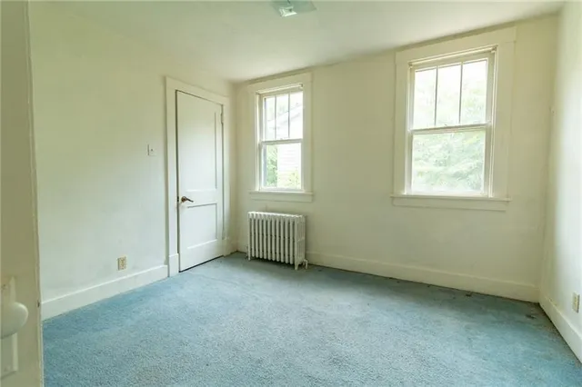 an empty room with windows