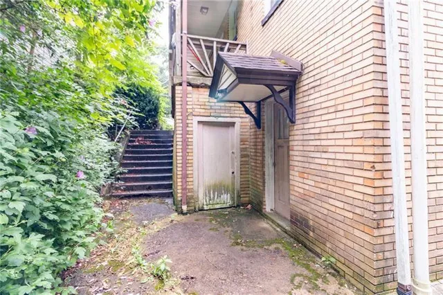 a view of a house with a yard and garage