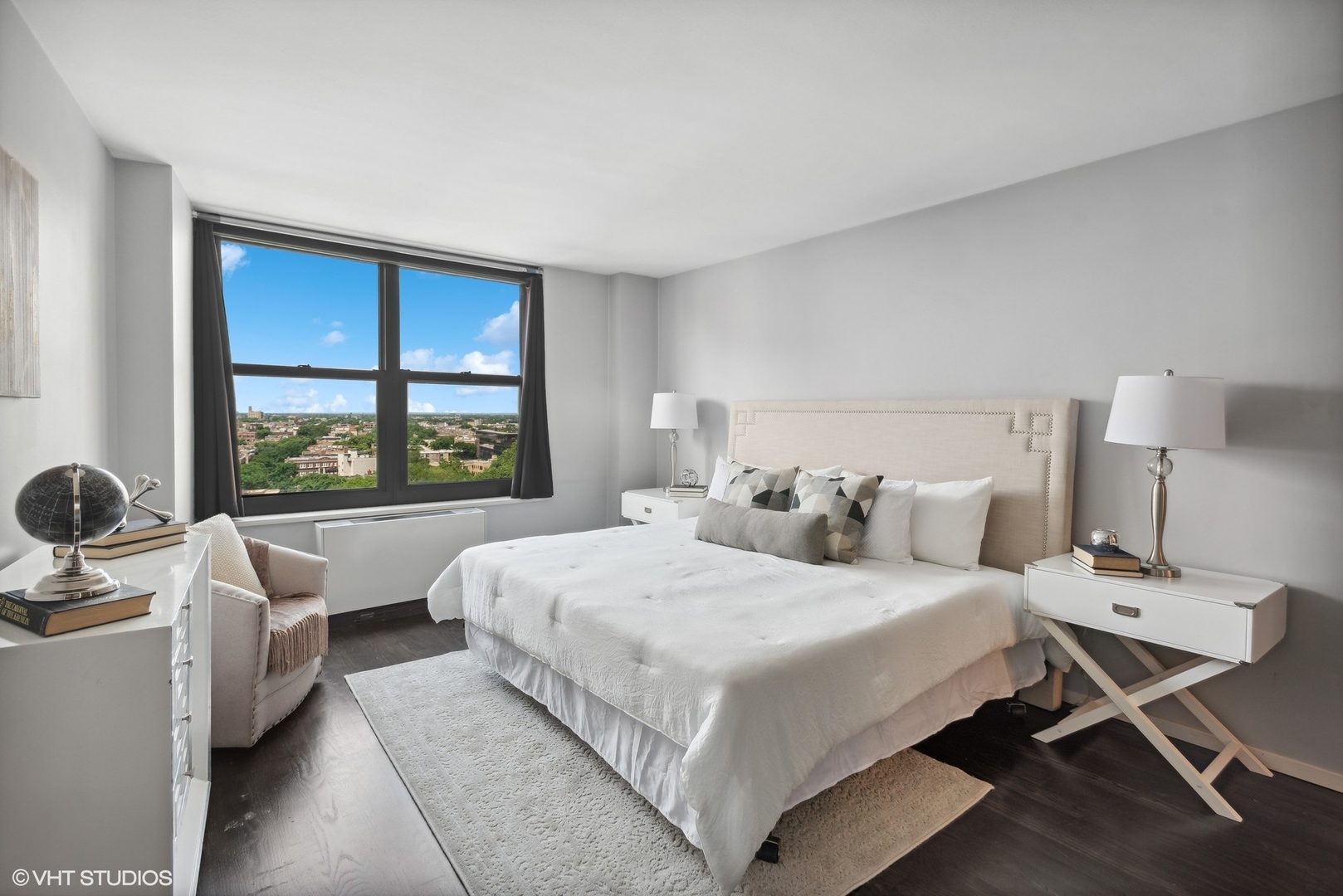 3430 North Lake Shore Drive, Unit 14P Chicago, IL 60657 - Photo 13 of 18 a bedroom with a bed and a large window