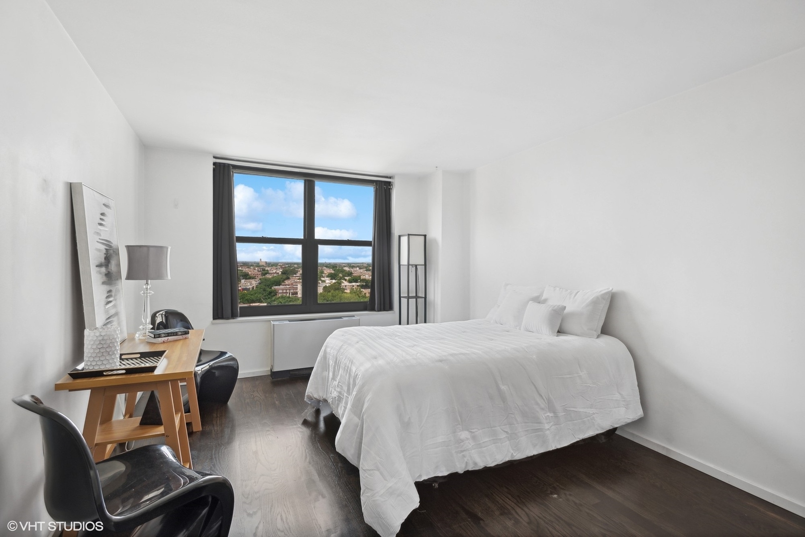 3430 North Lake Shore Drive, Unit 14P Chicago, IL 60657 - Photo 16 of 18 a bedroom with a bed and a window