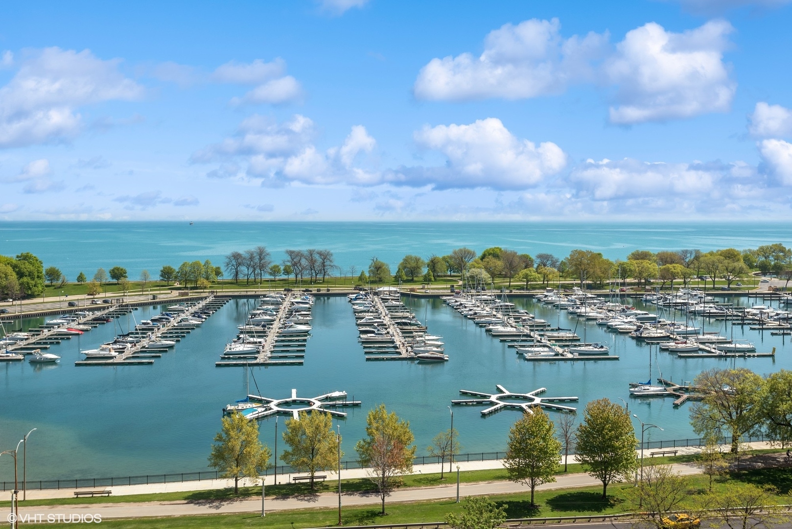 3430 North Lake Shore Drive, Unit 14P Chicago, IL 60657 - Photo 2 of 18 an aerial view of residential houses with outdoor space