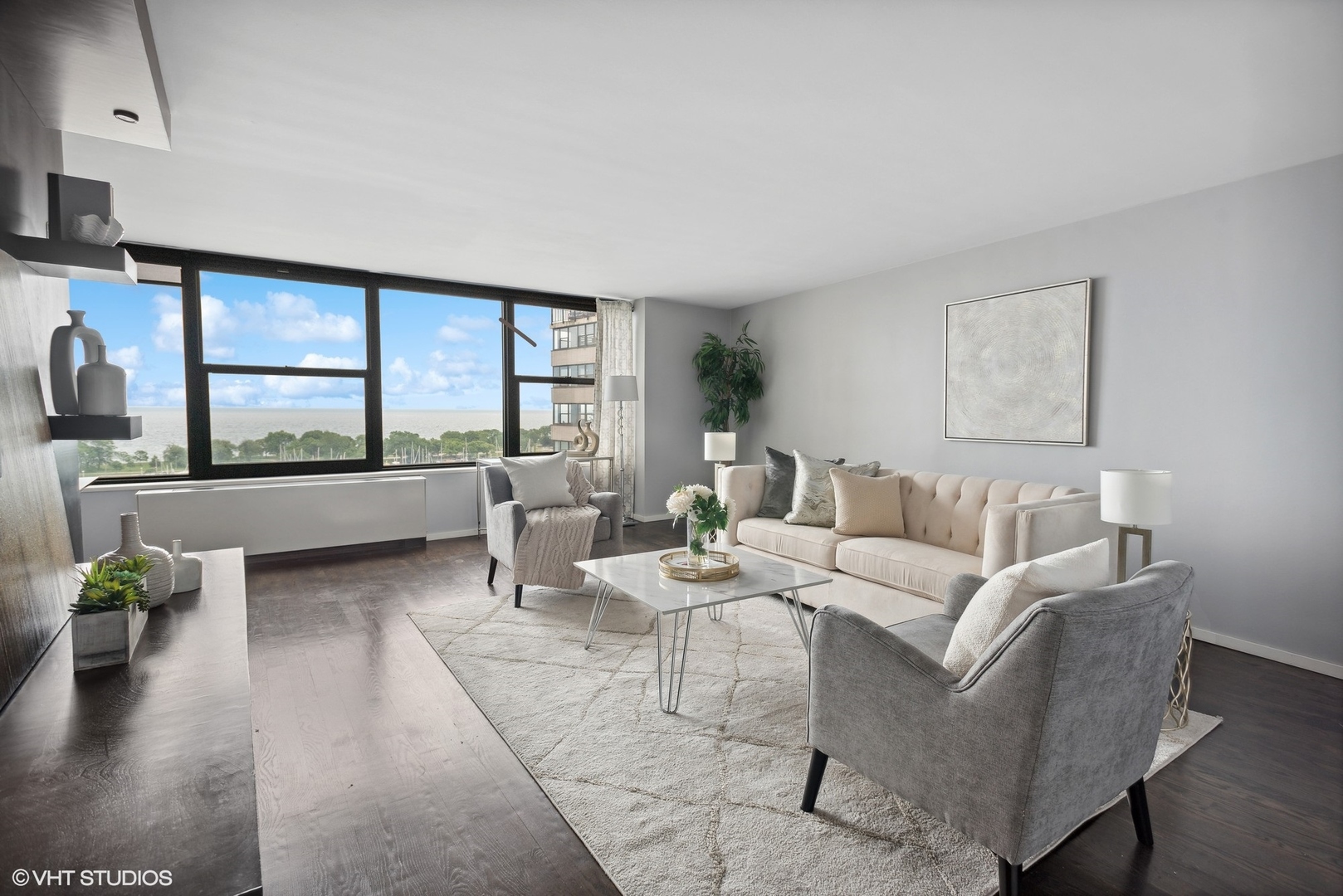 3430 North Lake Shore Drive, Unit 14P Chicago, IL 60657 - Photo 3 of 18 a living room with furniture and a large window