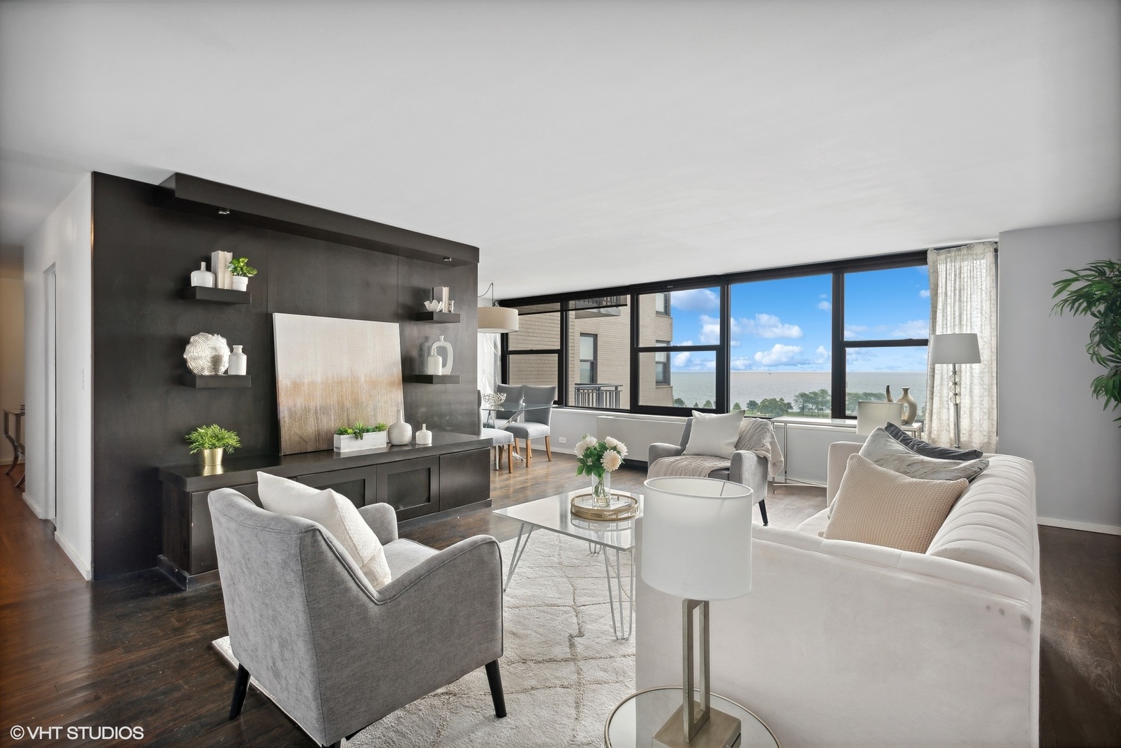 3430 North Lake Shore Drive, Unit 14P Chicago, IL 60657 - Photo 4 of 18 a living room with furniture and a large window