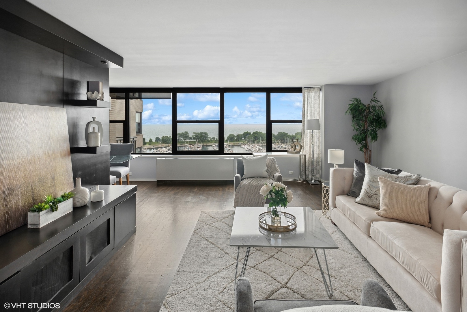 3430 North Lake Shore Drive, Unit 14P Chicago, IL 60657 - Photo 5 of 18 a living room with furniture and a flat screen tv