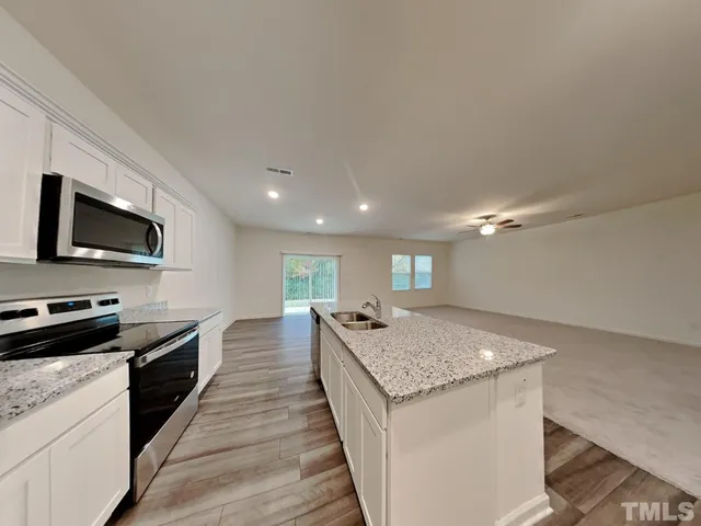 a kitchen with a stove and a sink