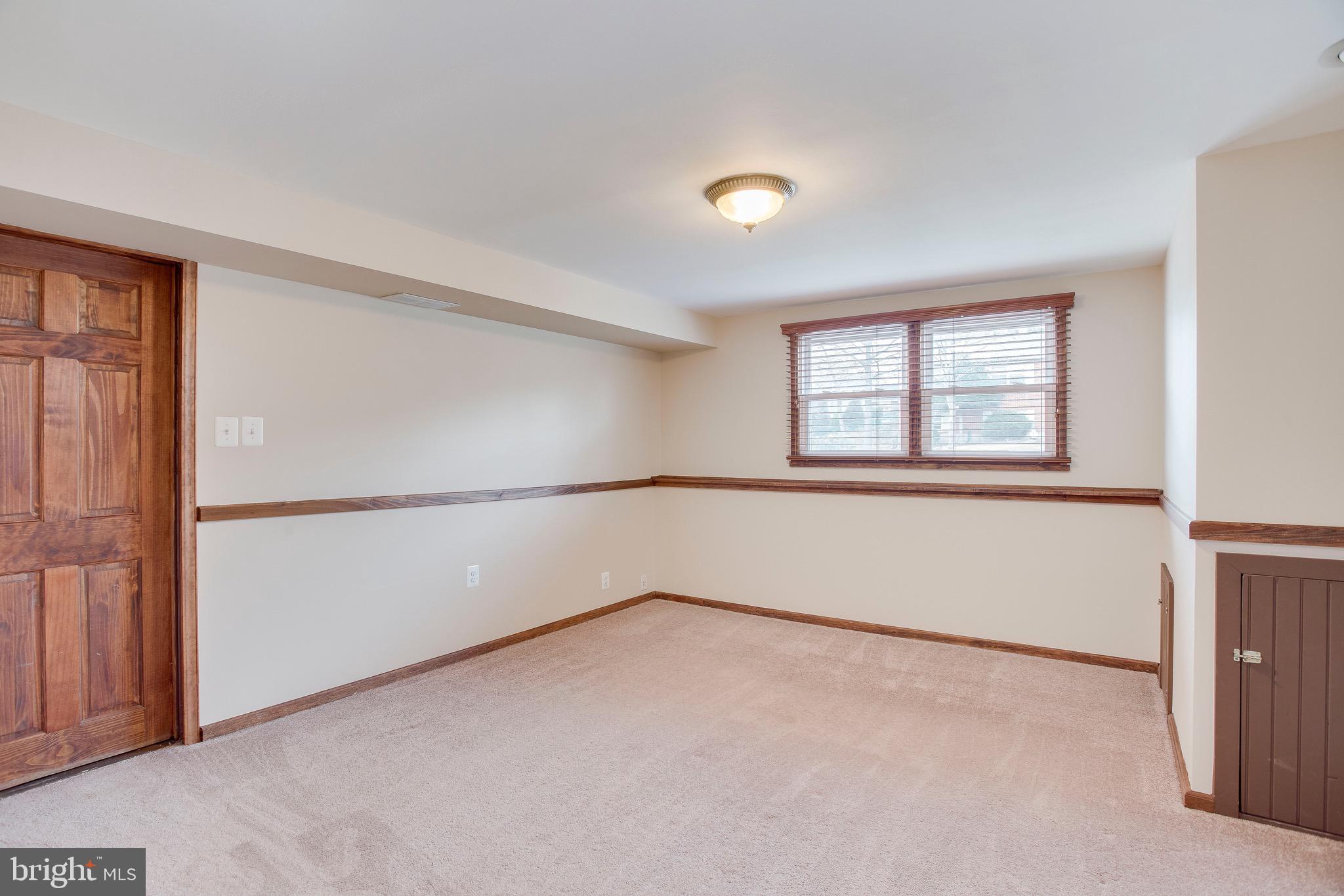 1913 Rollingwood Road Baltimore, MD 21228 - Photo 20 of 33 Freshly painted lower family room