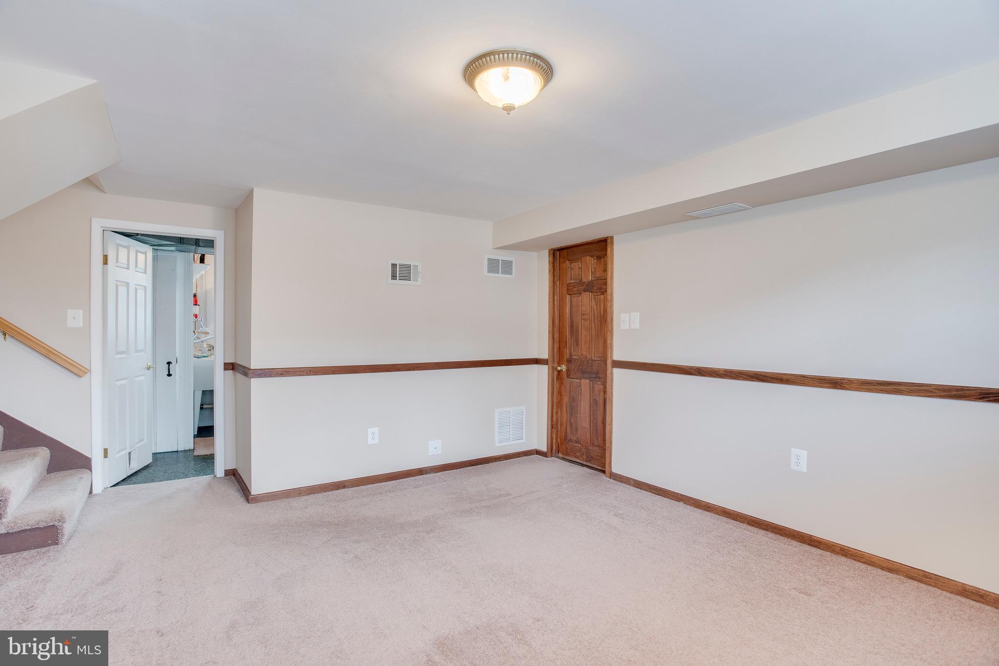 1913 Rollingwood Road Baltimore, MD 21228 - Photo 22 of 33 Natural wood door to garage + storage room