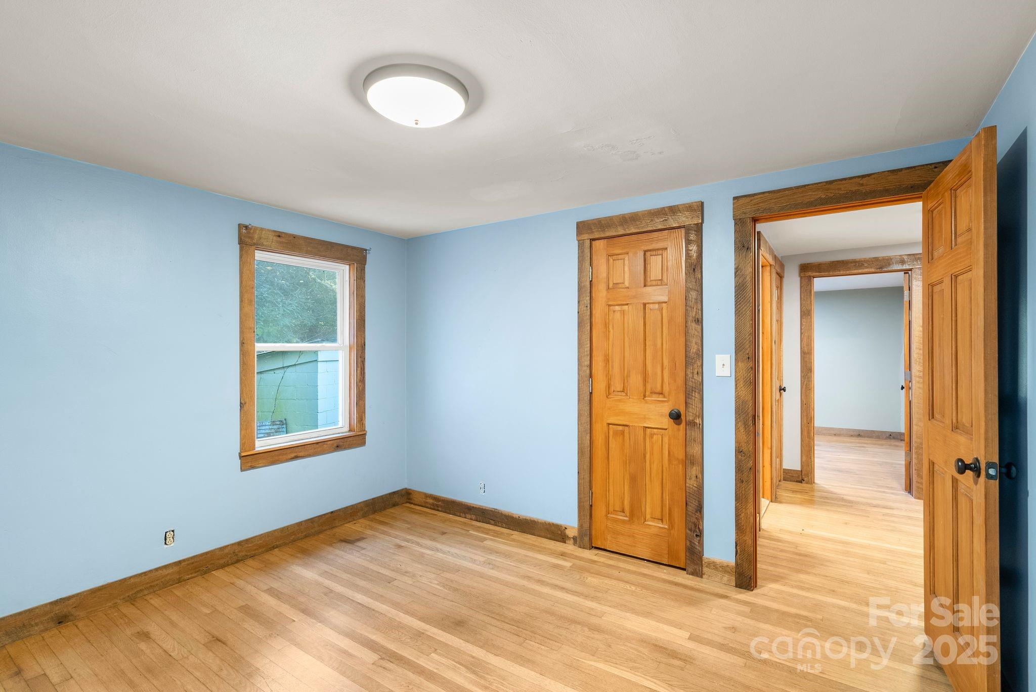 456 Rector Corner Road Marshall, NC 28753 - Photo 22 of 29 an empty room with windows and closet