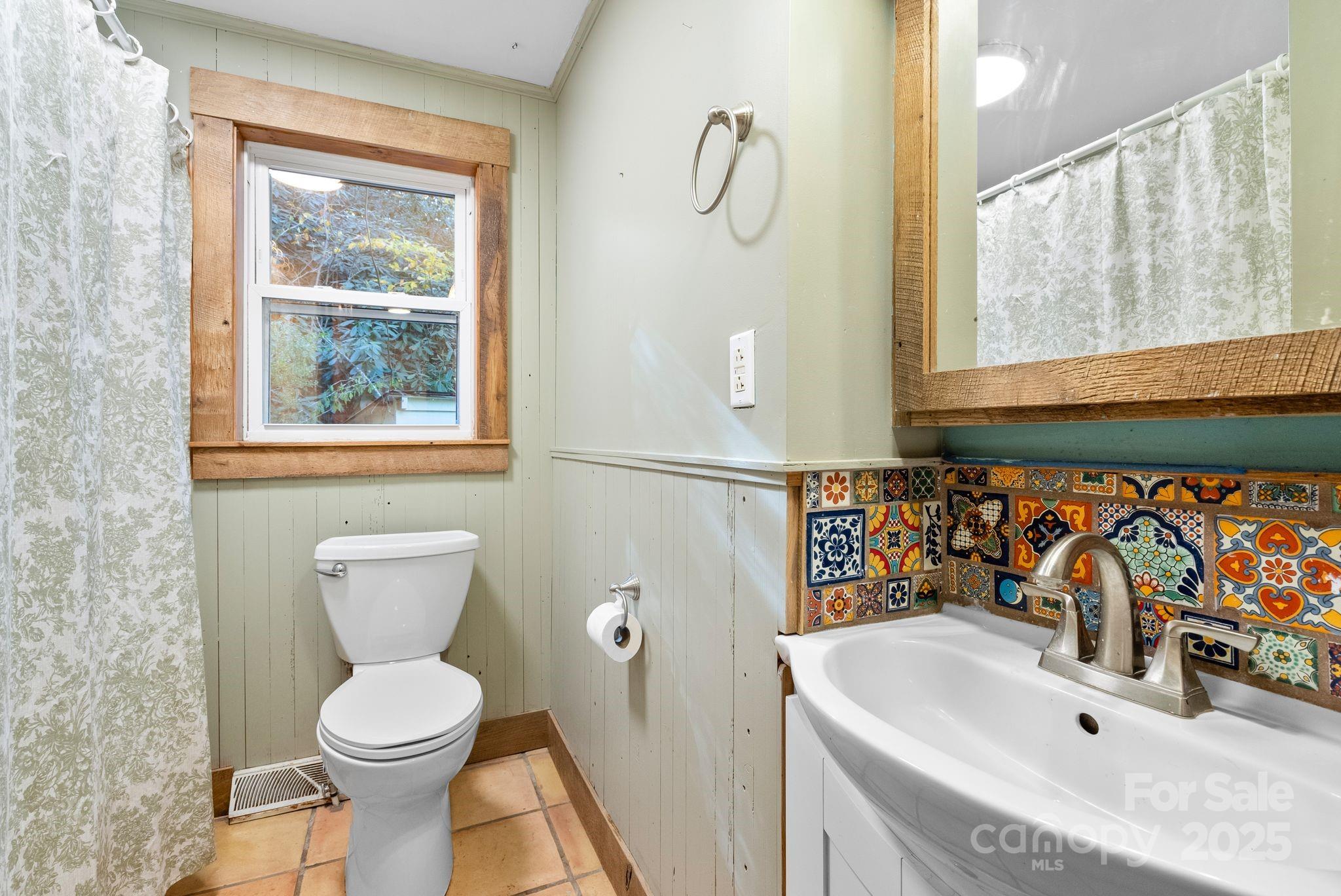 456 Rector Corner Road Marshall, NC 28753 - Photo 26 of 29 a bathroom with a sink a toilet and a window