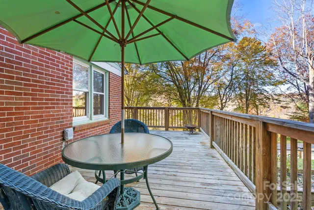 a balcony view with a seating space