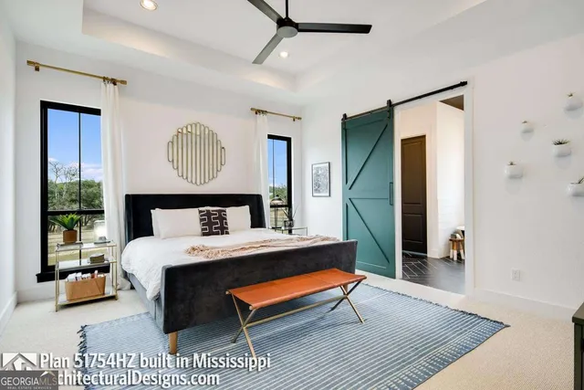 a bedroom with a bed and a table in it