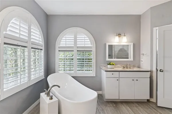 a bathroom with a bathtub and a shower