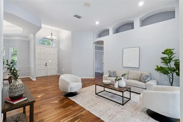 a living room with furniture and a large window