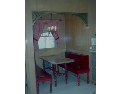 175 Woodcliff Road Newton, MA 02461 - Photo 4 of 6 a view of a dining room with a table and chairs