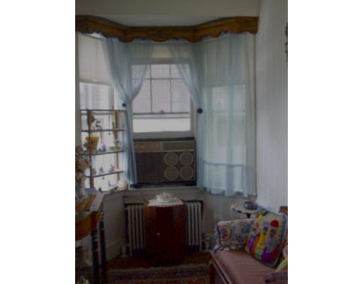 175 Woodcliff Road Newton, MA 02461 - Photo 6 of 6 a living room with furniture and a fireplace