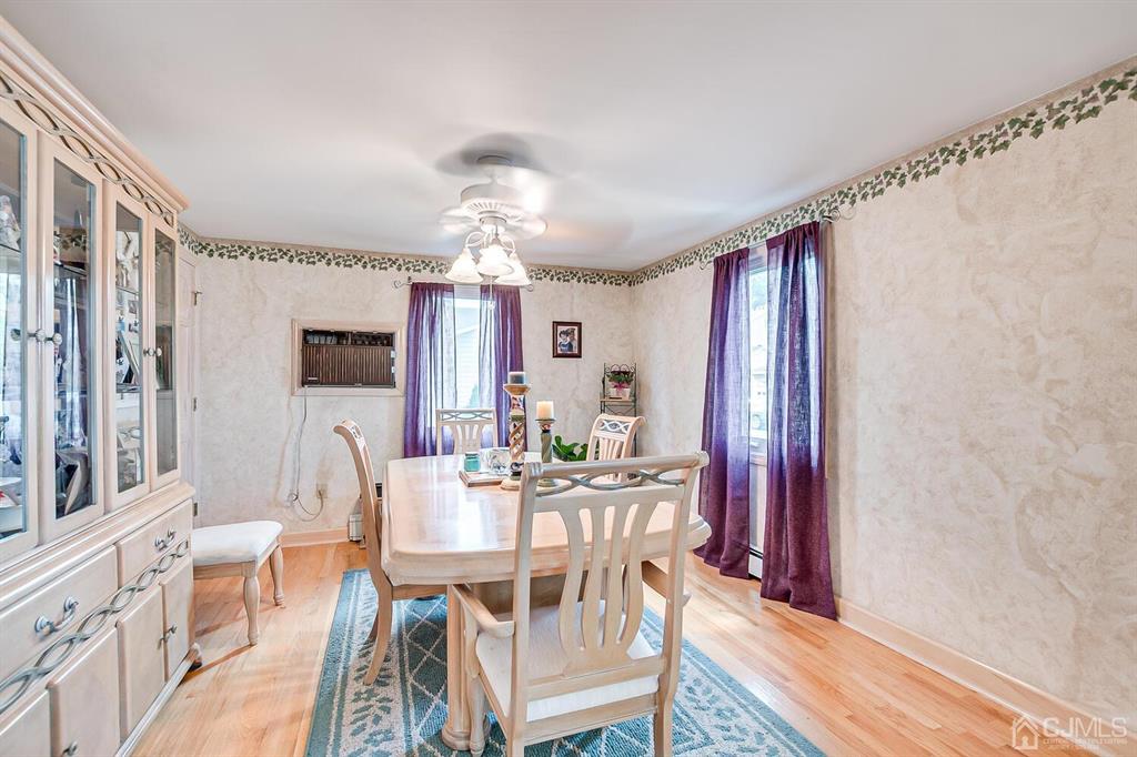 13 Highfield Road Colonia, NJ 07067 - Photo 11 of 42 a view of a dining room with furniture window and wooden floor