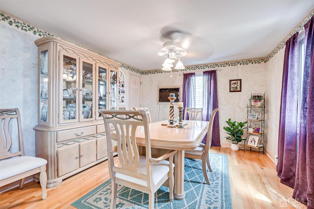 13 Highfield Road Colonia, NJ 07067 - Photo 12 of 42 a view of a dining room with furniture window and wooden floor