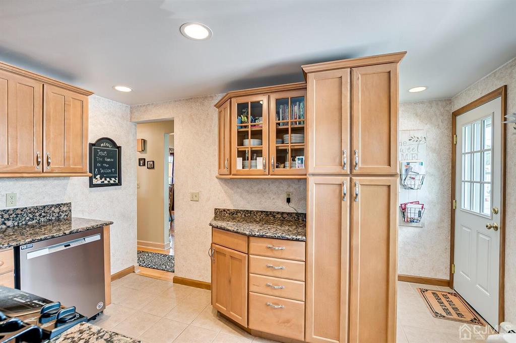 13 Highfield Road Colonia, NJ 07067 - Photo 15 of 42 a kitchen with a refrigerator and cabinets