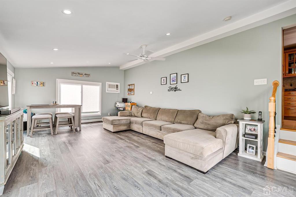 13 Highfield Road Colonia, NJ 07067 - Photo 17 of 42 a living room with furniture and a wooden floor