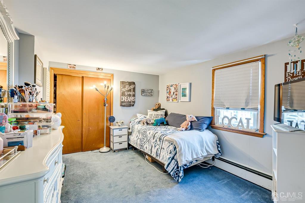 13 Highfield Road Colonia, NJ 07067 - Photo 25 of 42 a bedroom with a bed and a dresser