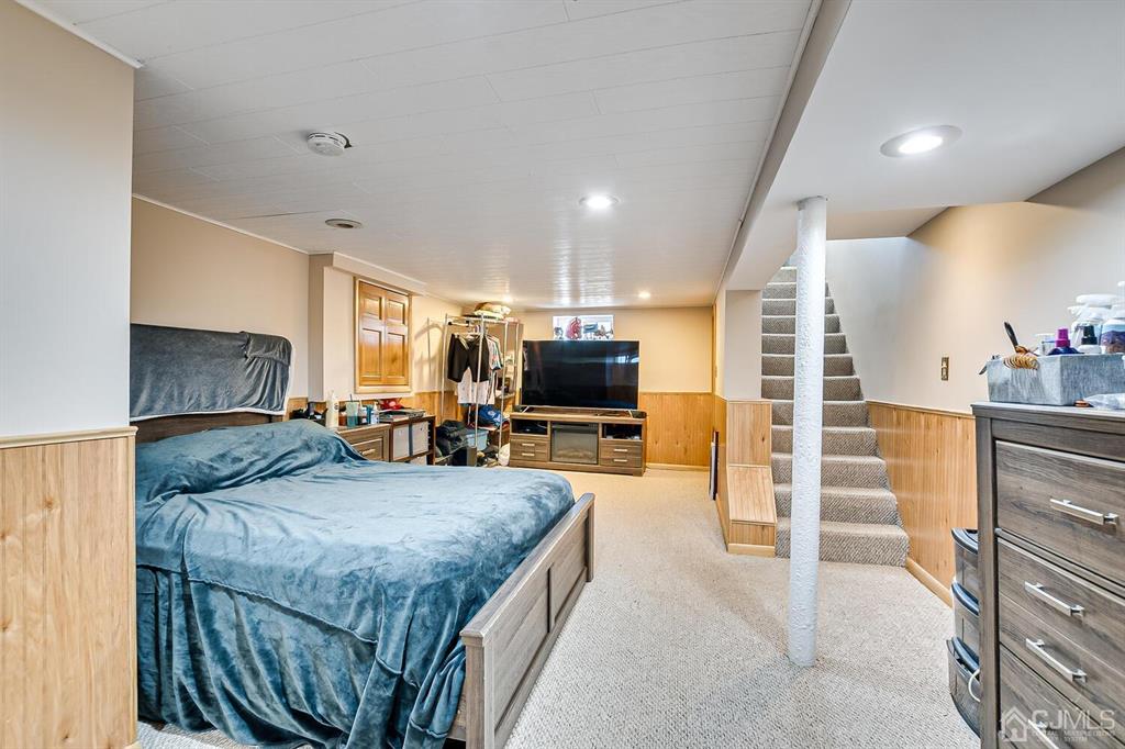 13 Highfield Road Colonia, NJ 07067 - Photo 27 of 42 a view of living room kitchen with furniture and flat screen tv