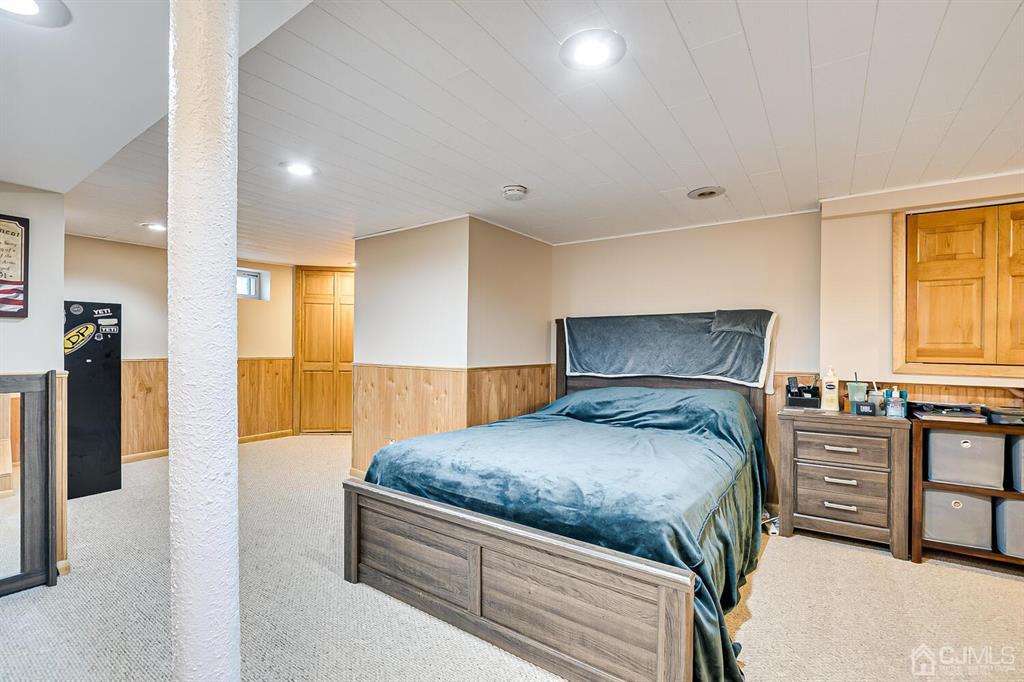 13 Highfield Road Colonia, NJ 07067 - Photo 28 of 42 a bedroom with a bed and dresser