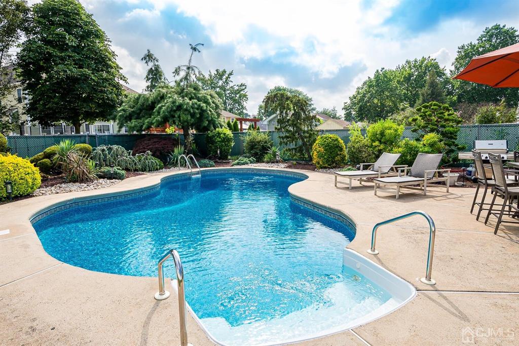 13 Highfield Road Colonia, NJ 07067 - Photo 32 of 42 a view of swimming pool with outdoor seating