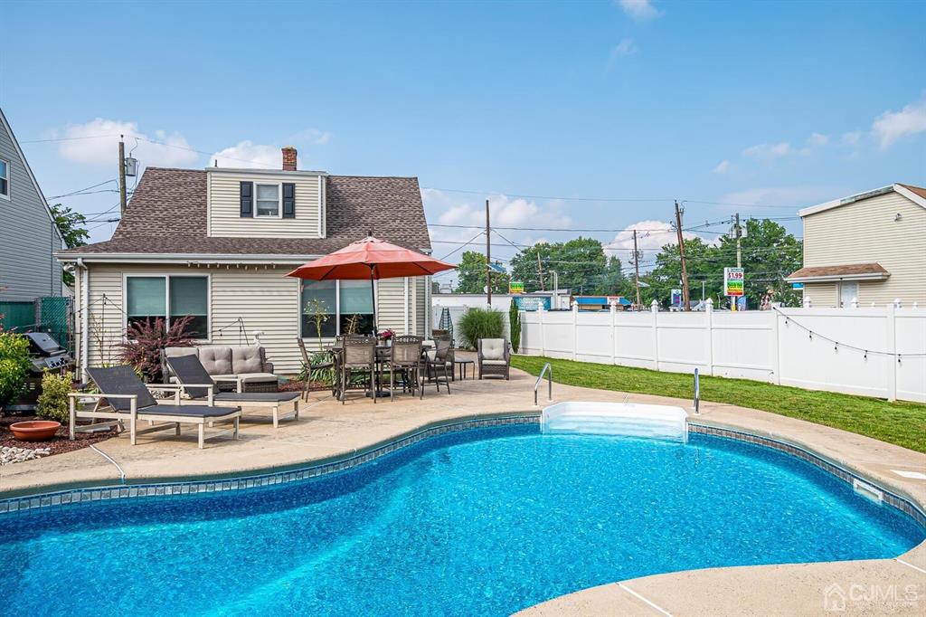 13 Highfield Road Colonia, NJ 07067 - Photo 33 of 42 a view of a house with swimming pool and sitting area