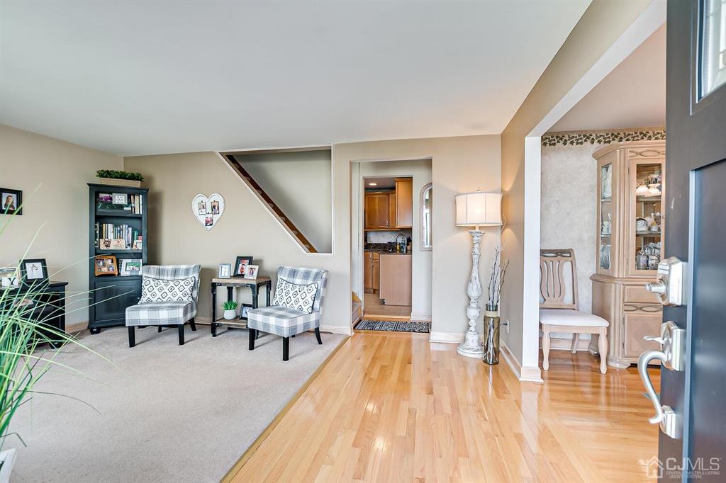 13 Highfield Road Colonia, NJ 07067 - Photo 8 of 42 a living room with furniture and a wooden floor