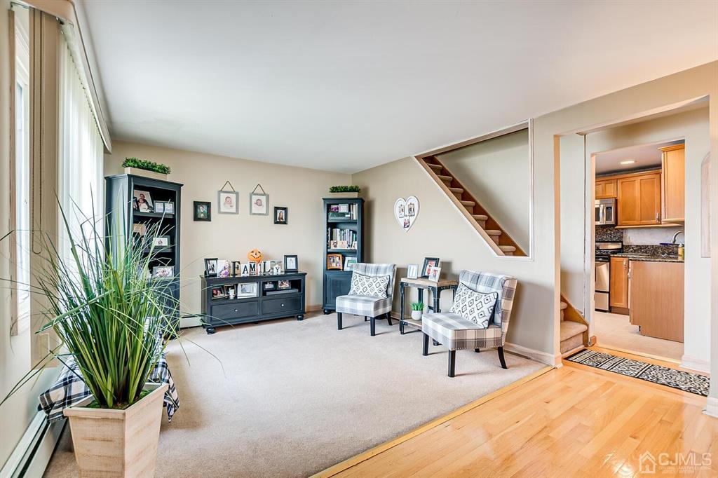 13 Highfield Road Colonia, NJ 07067 - Photo 10 of 42 a living room with furniture and a potted plant