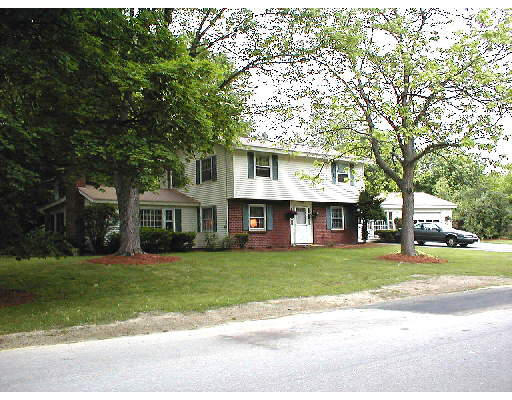 13 Howard Road Chelmsford, MA 01824 - Photo 1 of 1 a view of a house with a yard and large trees