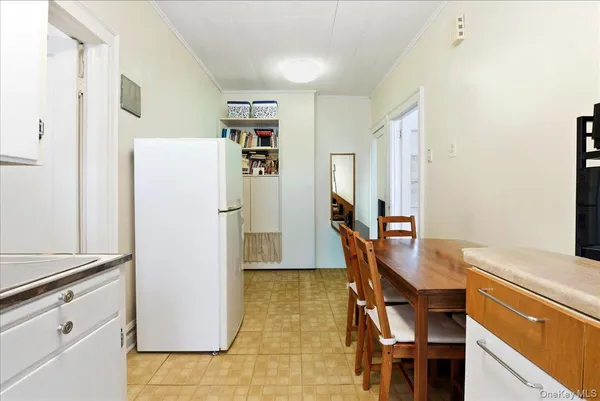 a kitchen with stainless steel appliances a refrigerator and a stove