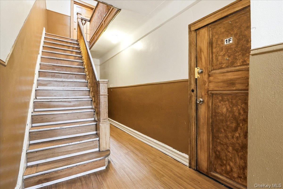 60-58 60th Road Queens, NY 11378 - Photo 20 of 25 a view of a door with wooden floor