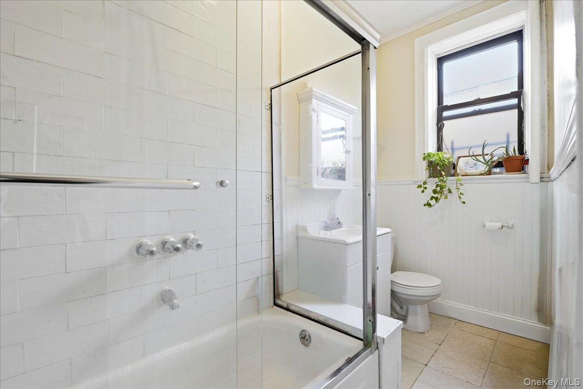 60-58 60th Road Queens, NY 11378 - Photo 2 of 25 a bathroom with a granite countertop sink a toilet and shower