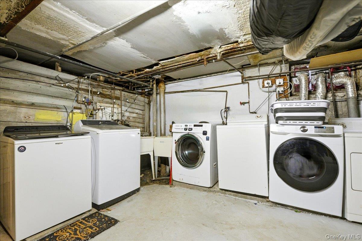 60-58 60th Road Queens, NY 11378 - Photo 21 of 25 a utility room with dryer and washer