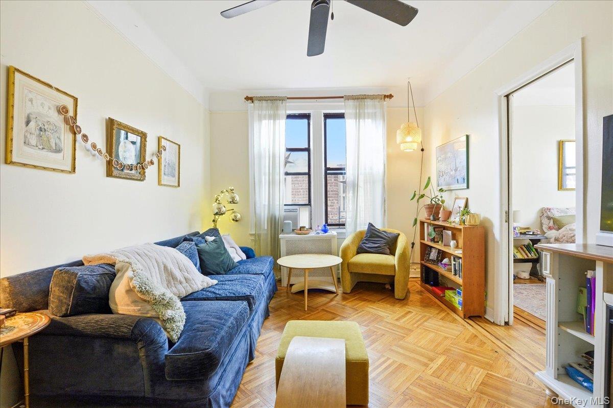 60-58 60th Road Queens, NY 11378 - Photo 6 of 25 a living room with furniture and large windows