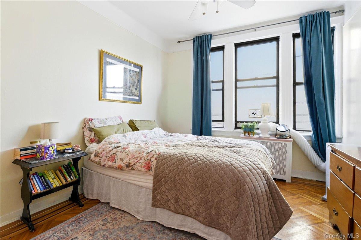 60-58 60th Road Queens, NY 11378 - Photo 7 of 25 a bedroom with a bed and a window