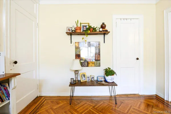a view of living room with furniture and wooden floor