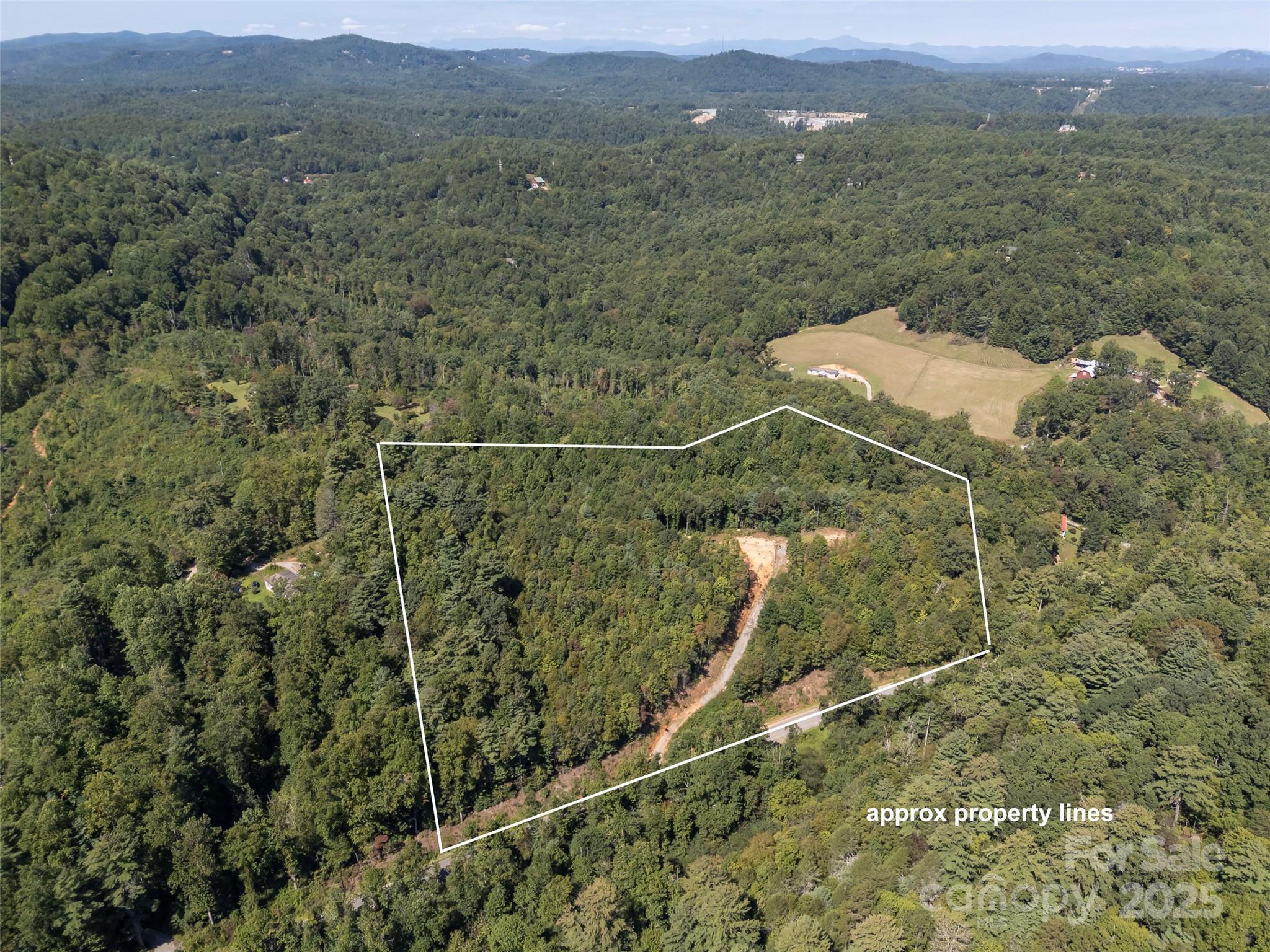 0 Camp Creek Road Saluda, NC 28773 - Photo 15 of 37 an aerial view of a house with a yard