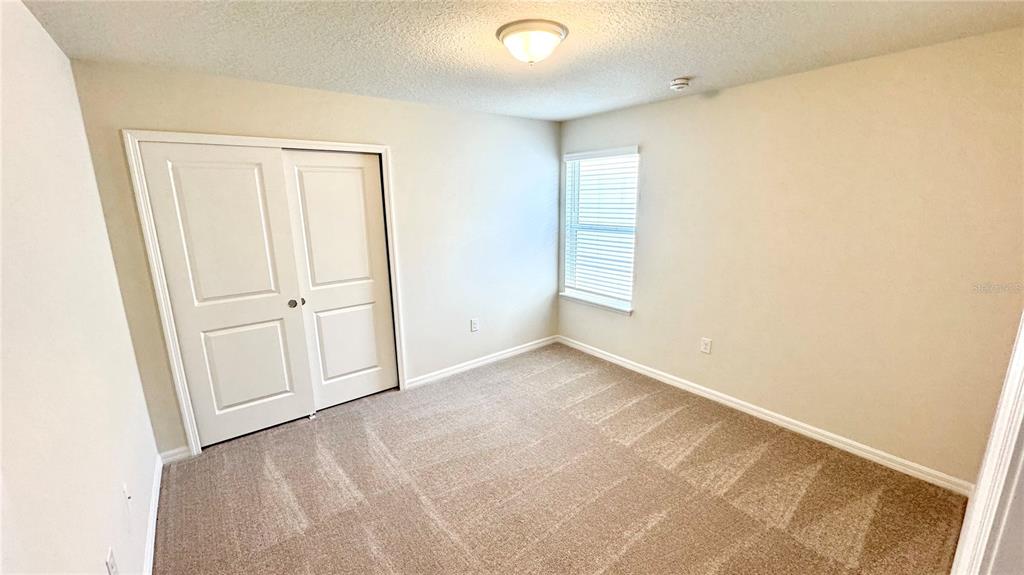 16248 St Kitts Circle Clermont, FL 34714 - Photo 16 of 27 an empty room with windows
