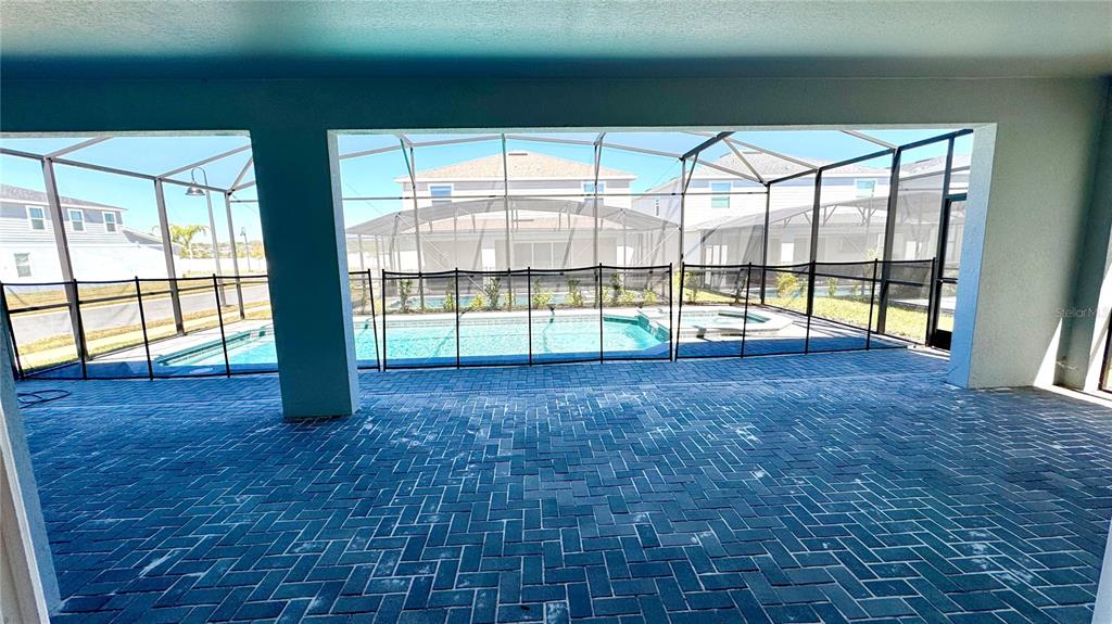 16248 St Kitts Circle Clermont, FL 34714 - Photo 26 of 27 a view of empty room with wooden floor and floor to ceiling window