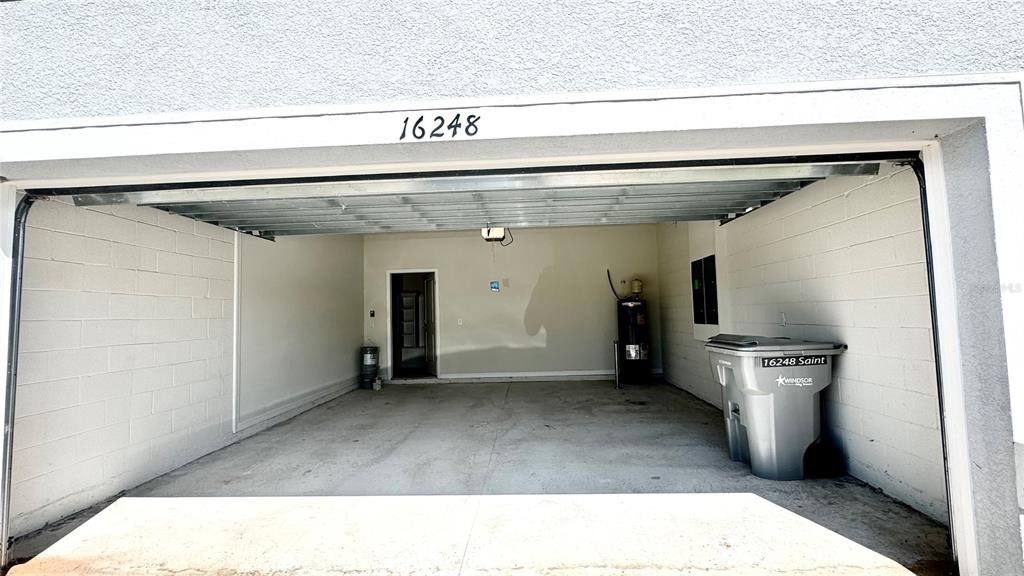 16248 St Kitts Circle Clermont, FL 34714 - Photo 27 of 27 a hallway with a stove and a refrigerator