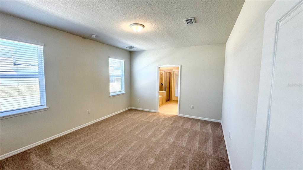 16248 St Kitts Circle Clermont, FL 34714 - Photo 10 of 27 a view of an empty room with a window