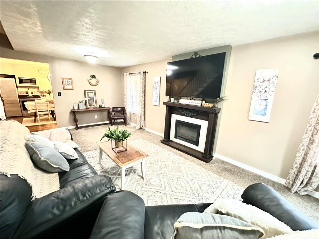 213 Fallen Timbers Road Point Marion, PA 15474 - Photo 7 of 16 a living room with furniture and a flat screen tv