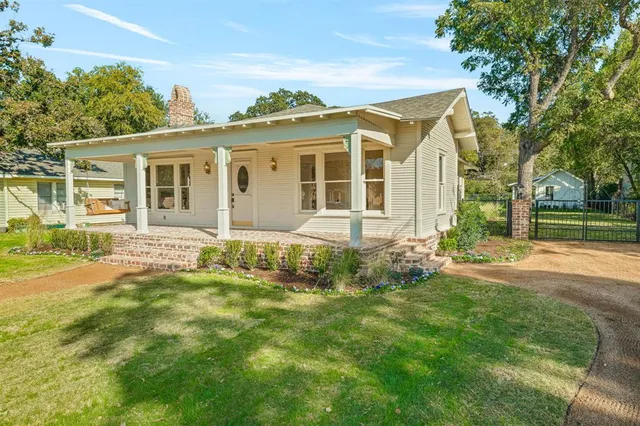front view of a house with a yard