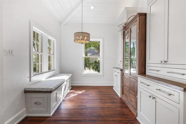 a view of entryway with kitchen island granite countertop wooden floor