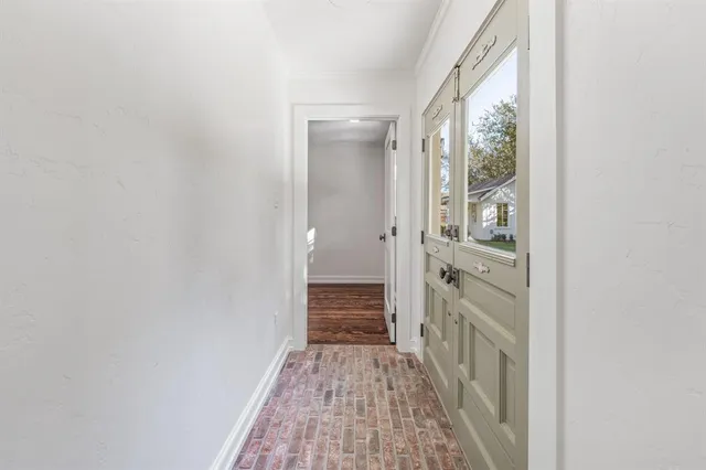 a view of a bathroom from the hallway