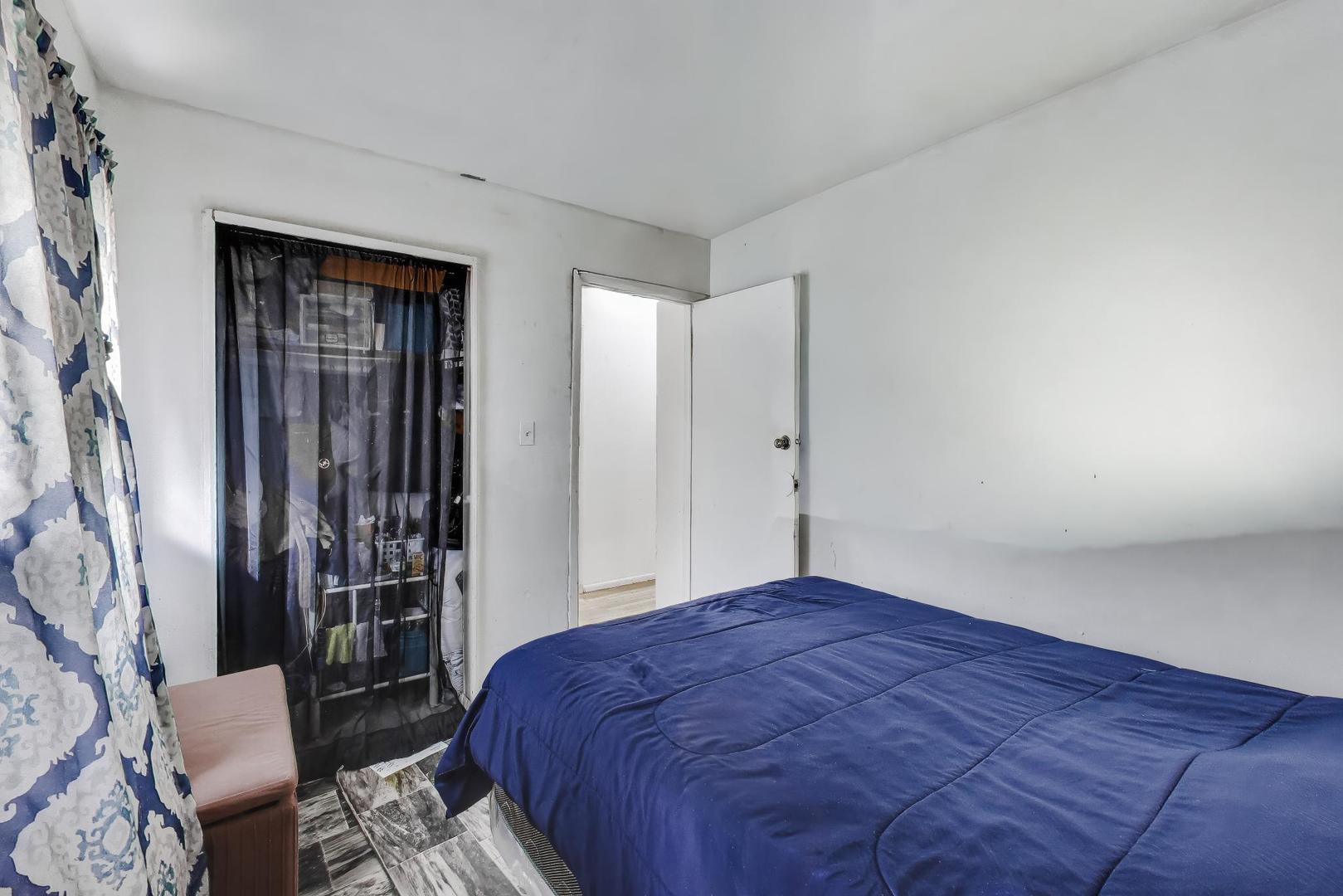 11746 South Racine Avenue Chicago, IL 60643 - Photo 11 of 24 a bedroom with a bed and a table