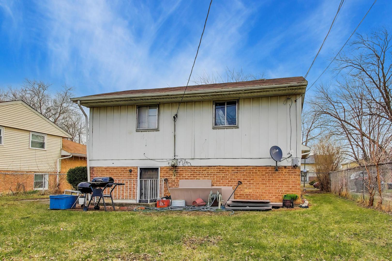 11746 South Racine Avenue Chicago, IL 60643 - Photo 17 of 24 a view of a house with backyard