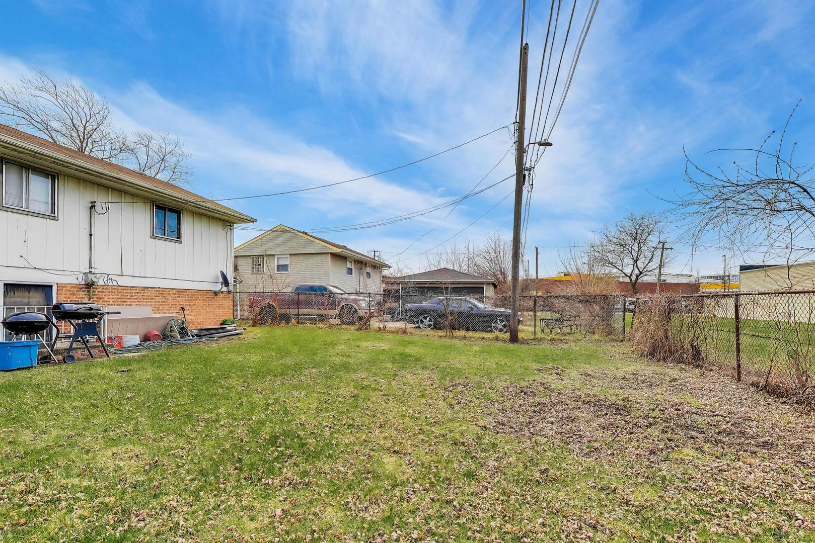11746 South Racine Avenue Chicago, IL 60643 - Photo 20 of 24 a view of a house with a yard